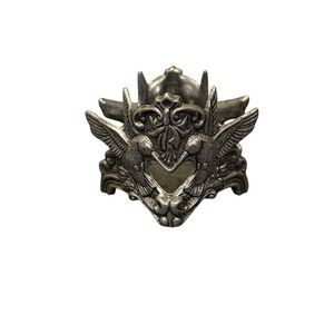 Pewter candle holder features hummingbirds and hearts